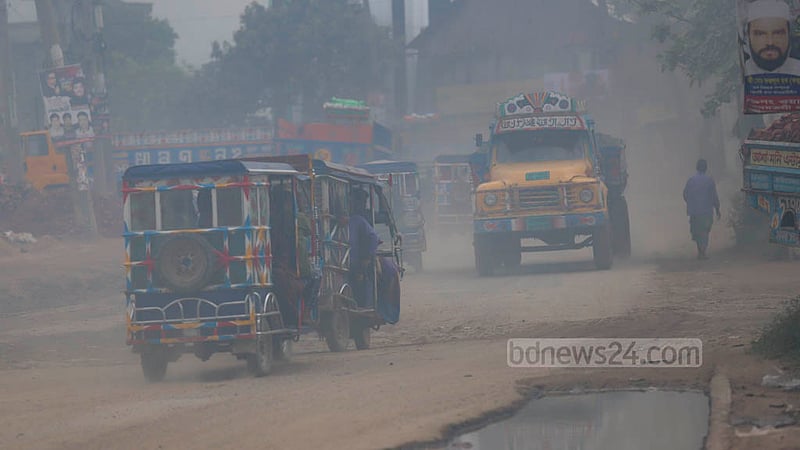 A cloud of dust blocks visibility every time a heavy vehicle passes through the Dhaka-Narayanganj Highway.