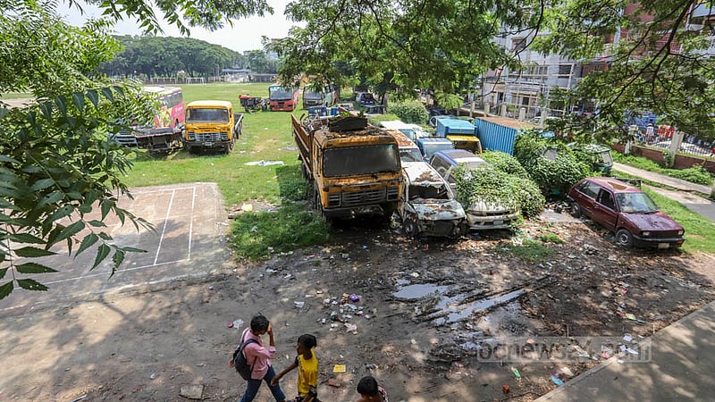 A part of the Eidgah and playground in Mirpur's Golartek is occupied by vehicles seized by the Darus Salam Police Station.