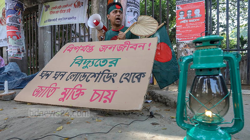 A young man named Mokhleshur Rahman protests outside the National Press Club in Dhaka on Friday, Oct 21, 2022 against rolling blackouts across Bangladesh.