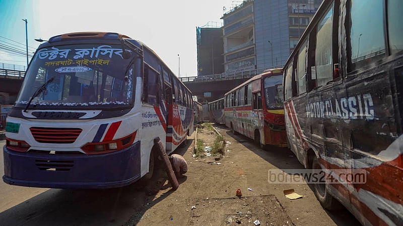 Two companies - Victor Classic and Akash Paribahan - are occupying the vacant space next to the flyover opposite the Rampura TV Centre in Dhaka and have set up a garage to repair their buses.