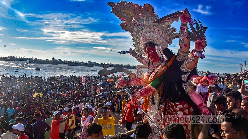 Hindu devotees bid farewell to goddess Durga through the immersion of her idols in the Bay of Bengal at Patenga in Chattogram on Wednesday, Oct 5, 2022.