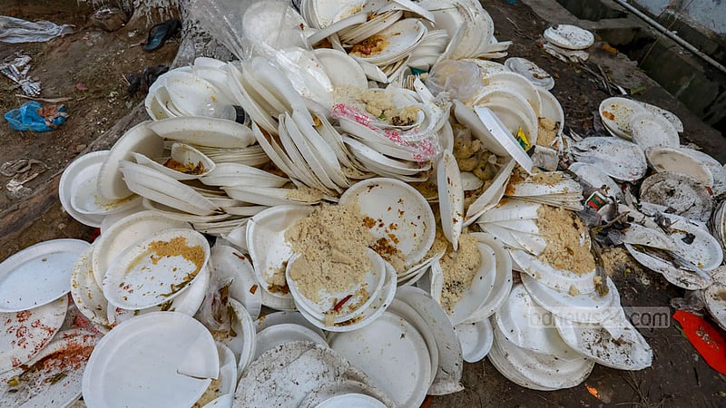 The shrine of Fakir Lalon Shah is littered with single-use plastic plates after a programme marking his 132nd death anniversary in Kushtia's Chheuriya. Plastic waste is posing an increasing threat to the environment in rural areas. Photo: Mostafigur Rahman