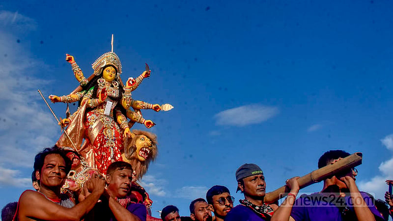 Hindu devotees bid farewell to goddess Durga with tears and love on Bijoya Dashami.
