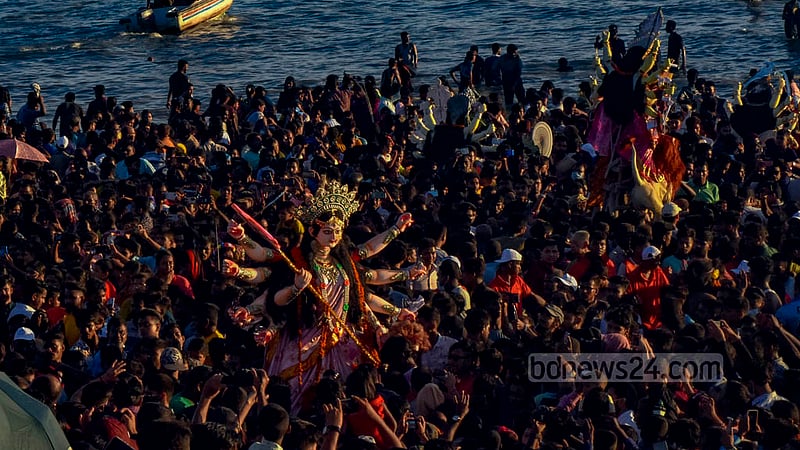 Hindu devotees bid farewell to goddess Durga through the immersion of her idols in the Bay of Bengal at Patenga in Chattogram on Wednesday, Oct 5, 2022.