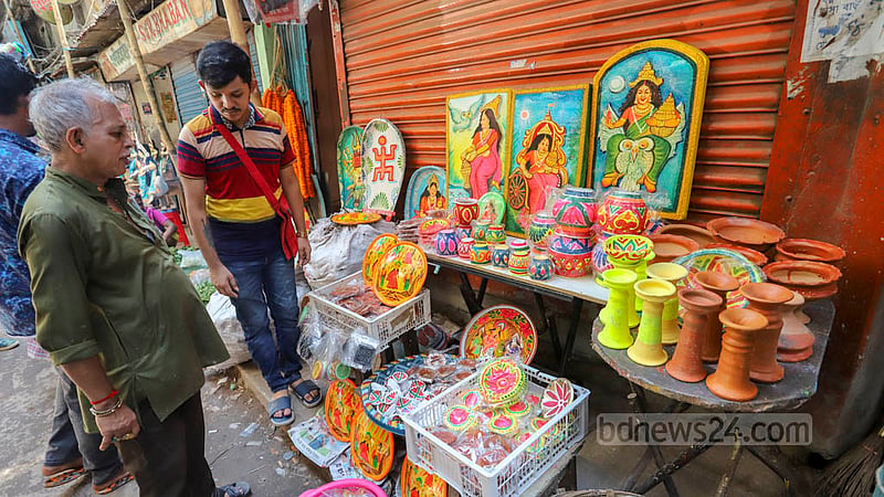 A shop at Old Dhaka's Shankhari Bazar displays various items used in the Lakshmi Puja ceremony.