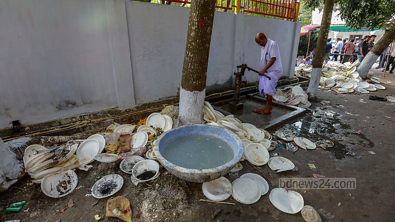 The shrine of Fakir Lalon Shah is littered with single-use plastic plates after a programme marking his 132nd death anniversary in Kushtia's Chheuriya. Plastic waste is posing an increasing threat to the environment in rural areas. Photo: Mostafigur Rahman