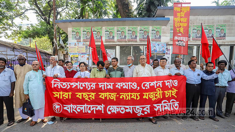 Members of Bangladesh Farm Labourers Association demonstrate outside the National Press Club in Dhaka on Friday, Oct 21, 2022 to demand fair wages and steps to cut prices of commodities.