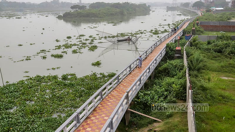 The walkway constructed by the Turag River is a favoured walking spot for locals in Bosila.
A walkway has been constructed on the banks of the Turag River after the demolition of illegal structures.