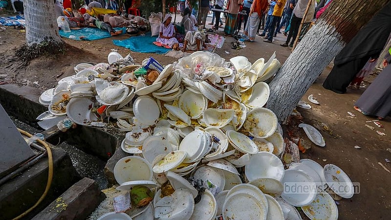 The shrine of Fakir Lalon Shah is littered with single-use plastic plates after a programme marking his 132nd death anniversary in Kushtia's Chheuriya. Plastic waste is posing an increasing threat to the environment in rural areas. Photo: Mostafigur Rahman