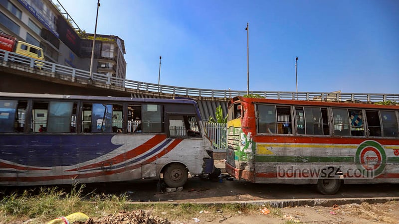 Two companies - Victor Classic and Akash Paribahan - are occupying the vacant space next to the flyover opposite the Rampura TV Centre in Dhaka and have set up a garage to repair their buses.
