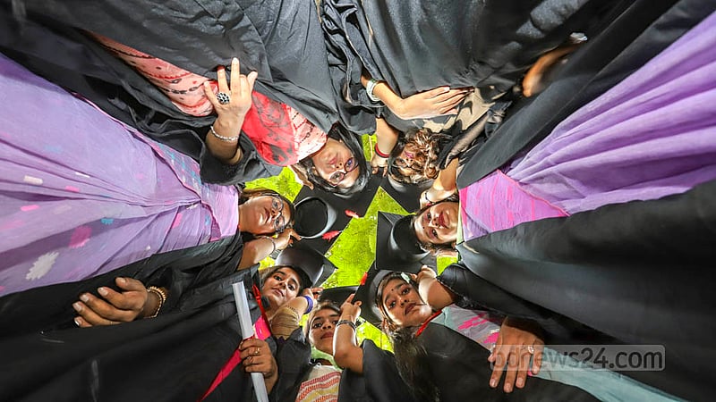 Dhaka University students wearing graduation gowns and caps rejoice at Curzon Hall on Friday, Nov 18, 2022, before their 53rd convocation. Photo: Asif Mahmud Ove