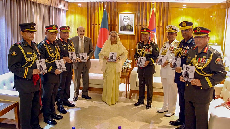 Prime Minister Sheikh Hasina unveils the cover of the book 'Bir Muktijoddha Sheikh Jamal: Ronangoner Diary' at the Armed Forces Division on Monday, Nov 21, 2022.Photo: PMO
