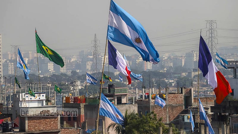 Flags appear on rooftops and houses in Amin Bazar as World Cup approaches. Photo taken on Sunday, Nov 20, 2022. Photo: Asif Mahmud Ove