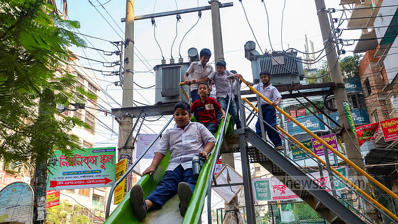 As there is no playground for children in Dhaka's Lakshmi Bazar area and its neighbourhood, mothers bring their children here to play for some time. Despite the risk of transformers being kept near, they are bringing children here. Photo: Mahmud Zaman Ovi