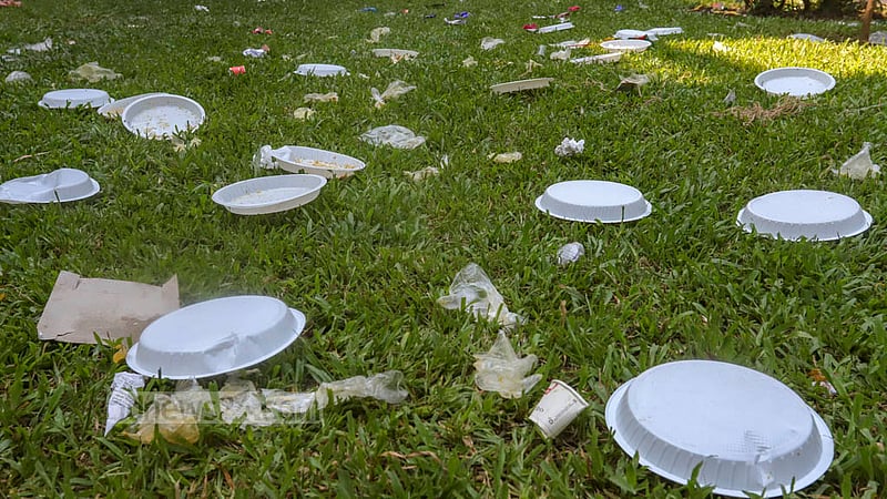 Jubo League supporters and leaders left behind plastic plates and boxes at Dhaka University’s Curzon Hall after attending an anniversary programme on Saturday, Nov 12, 2022. Photo: Asif Mahmud Ove