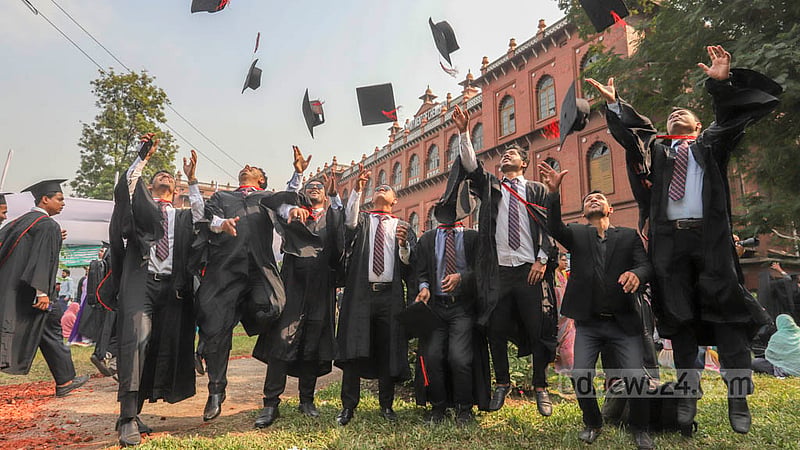 Dhaka University students wearing graduation gowns and caps rejoice at Curzon Hall on Friday, Nov 18, 2022, before their 53rd convocation. Photo: Asif Mahmud Ove
