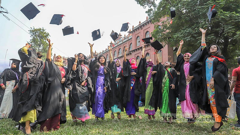 Dhaka University students wearing graduation gowns and caps rejoice at Curzon Hall on Friday, Nov 18, 2022, before their 53rd convocation. Photo: Asif Mahmud Ove