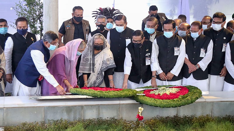 Prime Minister Sheikh Hasina and Awami League leaders lay wreaths at the graves of three of the four national leaders - Syed Nazrul Islam, Tajuddin Ahmad and M Mansur Ali - at the Banani graveyard in Dhaka on Thursday morning, marking Jail Killing Day. Photo: SM Gorky/ PMO