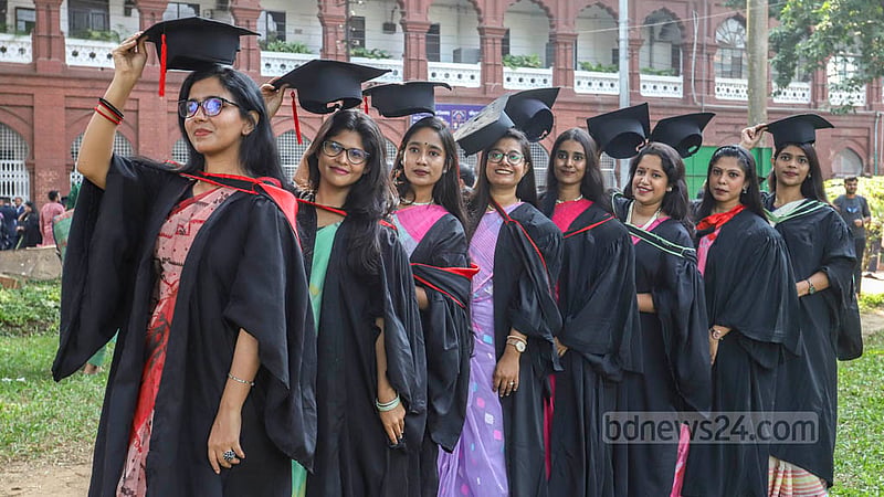 Dhaka University students wearing graduation gowns and caps rejoice at Curzon Hall on Friday, Nov 18, 2022, before their 53rd convocation. Photo: Asif Mahmud Ove