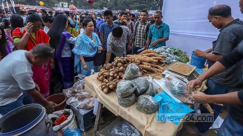 Traditional food items are sold at a stall during Garo harvest festival Wangala at Banani Bidyaniketan on Friday, Nov 18, 2022. Photo: Asif Mahmud Ove