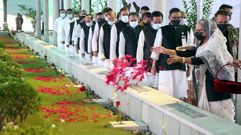 Prime Minister Sheikh Hasina and other Awami League leaders pay their respects at the graves of Bangabandhu's family members at the Banani graveyard in Dhaka on Thursday morning, marking Jail Killing Day. Photo: SM Gorky/ PMO