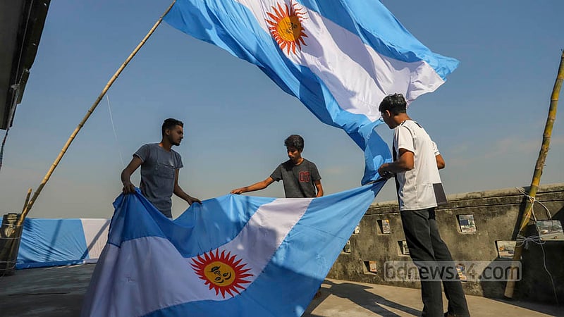 Football fans in the Amin Bazar suburb celebrate the start of the World Cup on Sunday, Nov 20, 2022. Photo: Asif Mahmud Ove