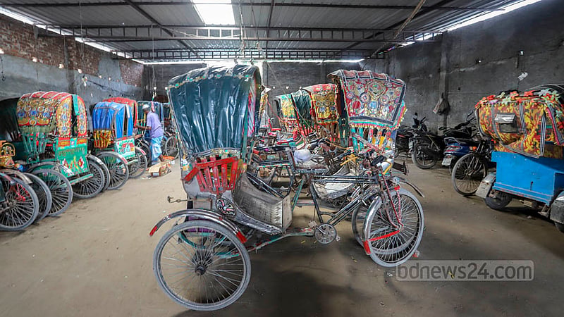 Easybikes and battery-powered rickshaws are being charged in a modified rickshaw garage. The electric lines used for such endeavours are illegal. Photo: Asif Mahmud Ove