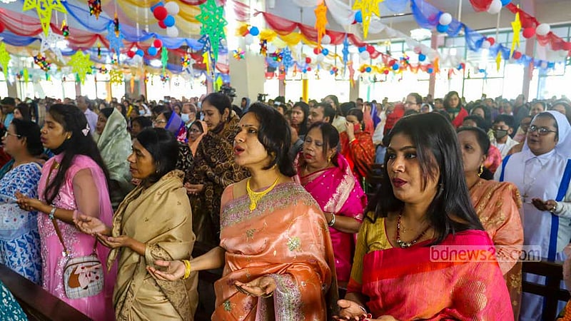 Women pray at the Holy Rosary Church in Dhaka’s Tejgaon on Christmas Day, Dec 25, 2022. Photo: Asif Mahmud Ove