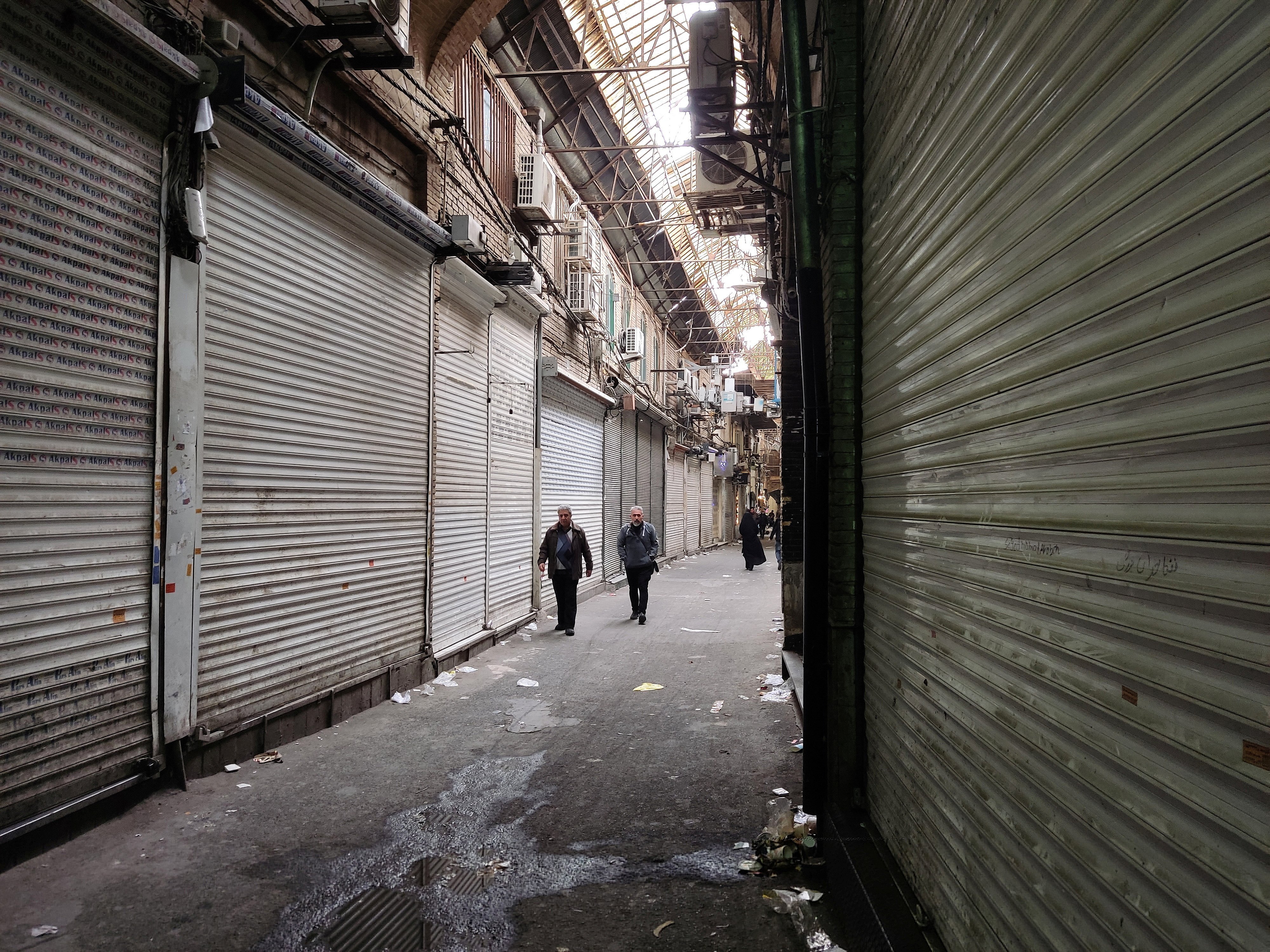 Iranian city shops shut after strike call, judiciary blames 'rioters'