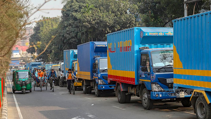 Trucks, pickups and covered vans are parked on both sides of the road from Saat Rasta to Karwan Bazar level crossing via Tejgaon truck stand. As a result, the road has become narrow, hampering traffic. Photo: Mahmud Zaman Ovi