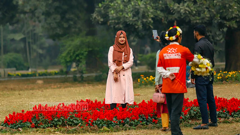 Many visitors breach fences and trample flowers to take photos at Ramna Park in Dhaka. Photo: Mahmud Zaman Ovi