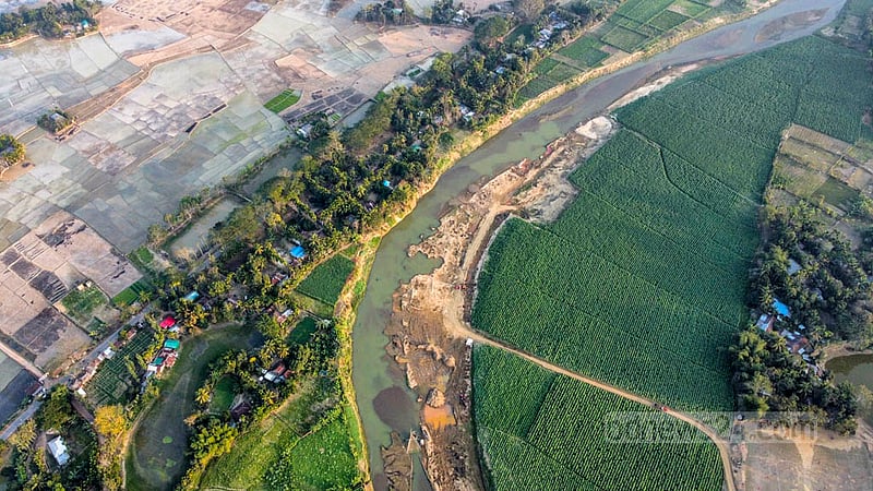 The Maini river, formed by the confluence of numerous mountain streams in the Indian state of Tripura, flows through Khagrachhari's Dighinala and merges with the Kaptai Lake. Tobacco fields run along the banks of the river. Photo: Samir Mallik