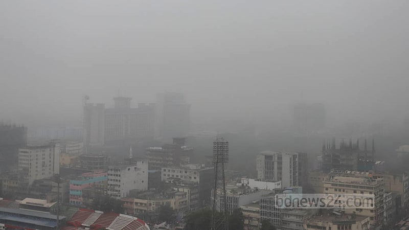 A layer of dense winter fog hangs around the Nagar Bhaban headquarters of Dhaka South City Corporation on Wednesday afternoon, Jan 4, 2023. Photo: Asif Mahmud Ove