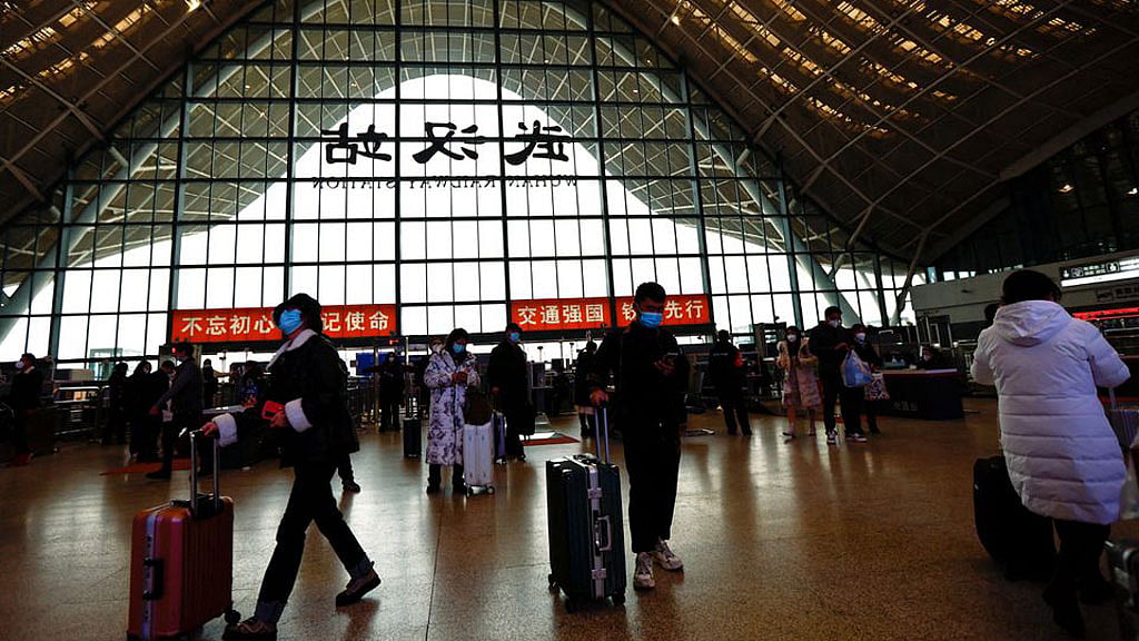 China state media plays down severity of COVID wave before WHO meeting