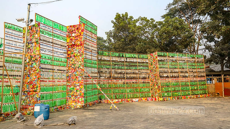 The T&amp;T ground in Dhaka's Mohakhali is surrounded by walls made of discarded plastic bottles, polythene and packets of chips. Within the walls, a volunteer group is showcasing recycled art to highlighted various harmful effects of plastic pollution on the environment and biodiversity. Photo: Asif Mahmud Ove