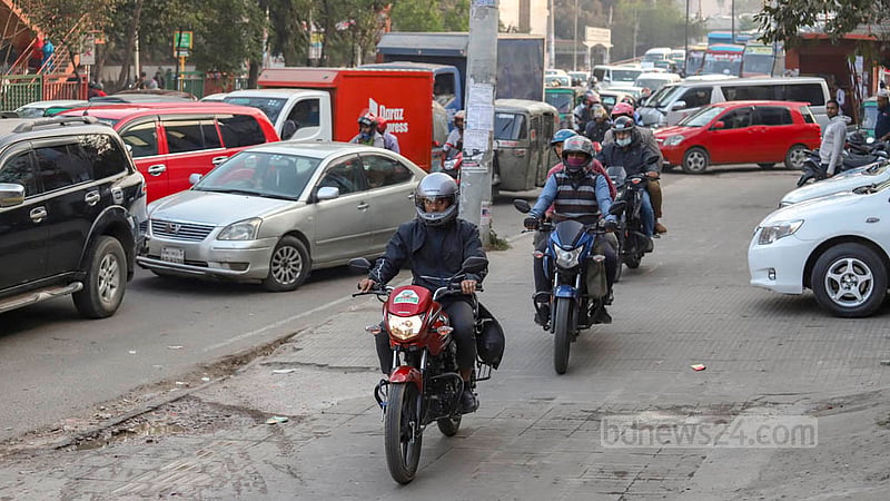 Motorcyclists steered onto the footpaths of Shaheed Tajuddin Ahmed Sarani to beat a logjam on Thursday, Feb 2, 2023. Photo: Asif Mahmud Ove