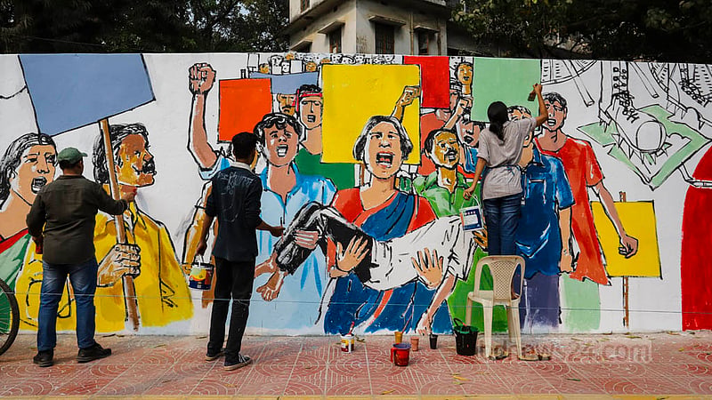 An artist depicts the 1952 Language Movement on a wall near the Central Shaheed Minar in Dhaka on Sunday, Feb 19, 2023, ahead of International Mother Language Day.