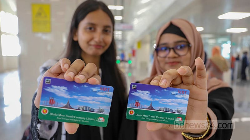 Excited passengers show metro train tickets at Uttara Centre after the station’s inauguration on Saturday, Feb 18, 2023. Photo: Asif Mahmud Ove