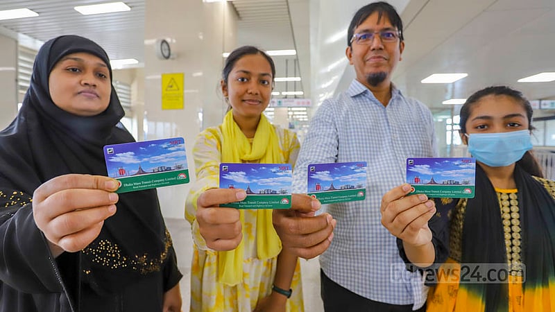Excited passengers show metro train tickets at Uttara Centre after the station’s inauguration on Saturday, Feb 18, 2023.  Photo: Asif Mahmud Ove