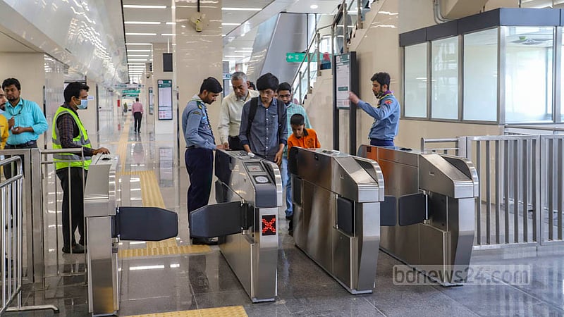 Passengers board a metro train at Uttara Centre after the station’s inauguration on Saturday, Feb 18, 2023. Photo: Asif Mahmud Ove