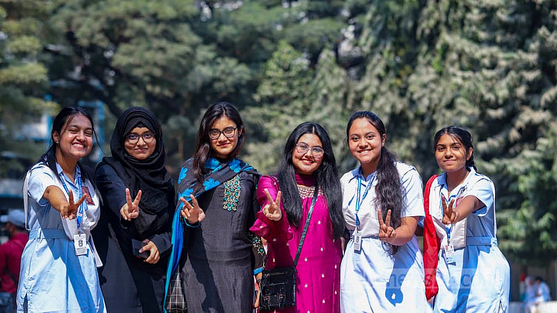 Humanities stream students of Viqarunnisa Noon School and College who got a GPA 5 in the HSC exams gesture with the victory sign after the publication of the results on Wednesday, Feb 8, 2023 . Photo: Mahmud Zaman Ovi