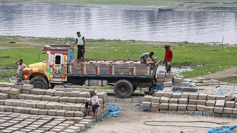 Trucks carry blocks which will be used to construct embankments along the Turag River in Mirpur’s Diabari. Photo: Asif Mahmud Ove