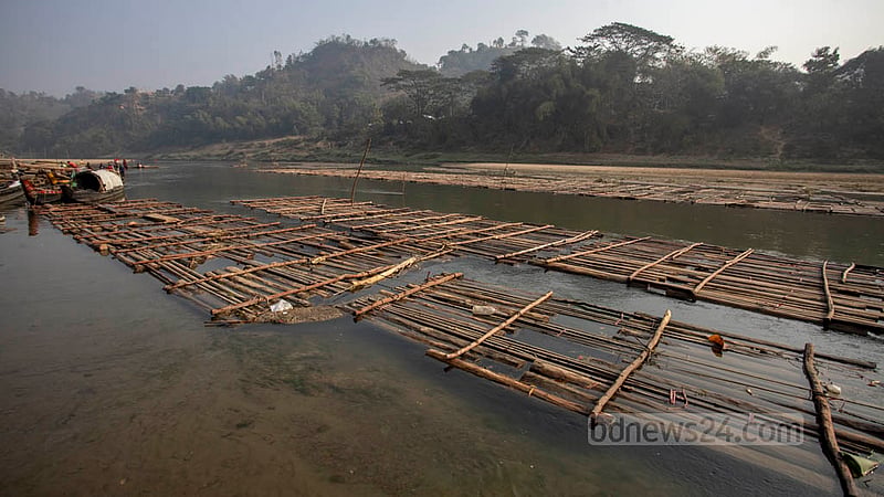 Wood cut deep in the Bandarban forest is sometimes carried on locally made bamboo vessels to the Ujani Para pier. Photo: Asif Mahmud Ove