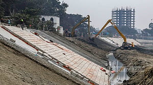 Barriers, walkways under construction along Turag River