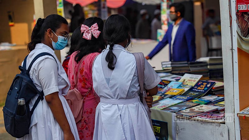 Students Amar Ekushey Book Fair in Dhaka on Monday, Feb 27, 2023. Photo: Mahmud Zaman Ovi