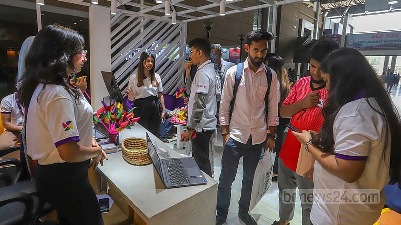 People visit a stall on the first day of the three-day-long Bangladesh Travel and Tourism Fair at the Bangabandhu International Conference Centre in Dhaka on Thursday, Mar 2, 2023. Photo: Asif Mahmud Ove