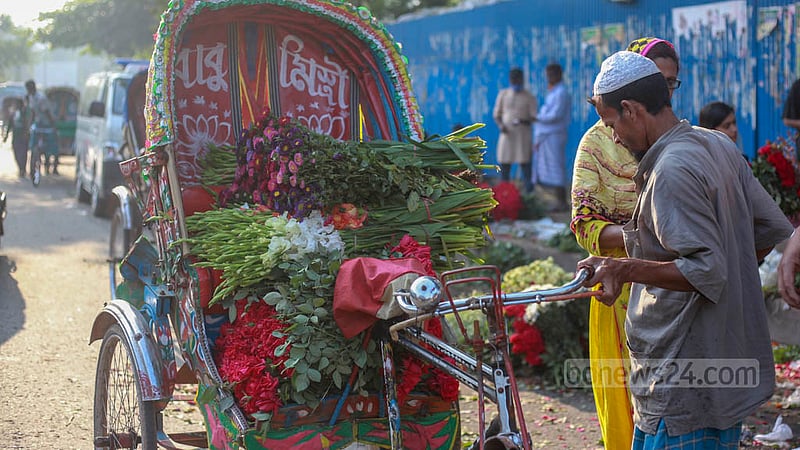Customers leave on rickshaws after buying flowers from the wholesale flower market in Dhaka’s Shahbagh. Photo: Tawhiduzzaman Tapu
