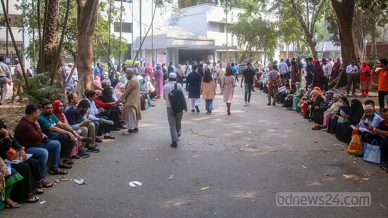 Parents wait outside Dhaka University’s Arts Building during the medical college admission test on Friday, Mar 10, 2023. Photo: Tawhiduzzaman Tapu