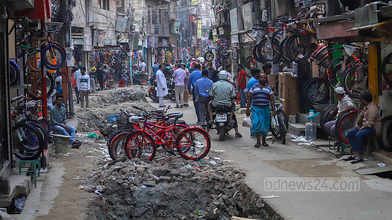 Kazi Alauddin Road in Old Dhaka houses a variety of wholesale stores on either side. Repair works are affecting the sale and transportation of products at these shops. Photo: Mahmud Zaman Ovi