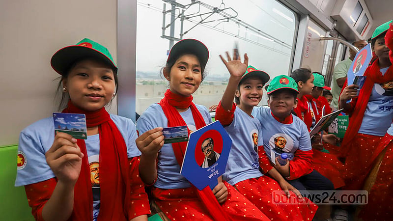 Children from two orphanages take a joy ride on the metro from Agargaon to Uttara North as part of celebrations of Bangabandhu's birth anniversary and National Children's Day on Friday, Mar 17, 2023. Photo: Asif Mahmud Ove